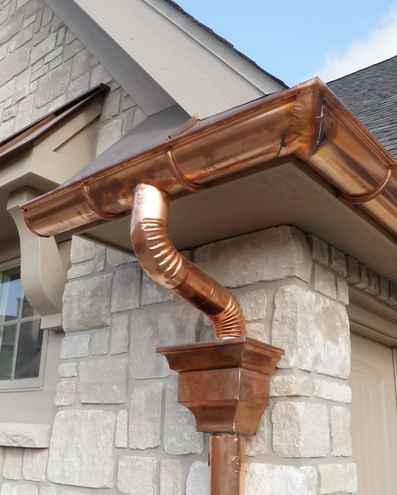 Seamless copper gutter and downspout installation